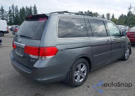 2009 Honda Odyssey Touring z USA, uszkodzony, nr VIN 5FNRL389X9B039650